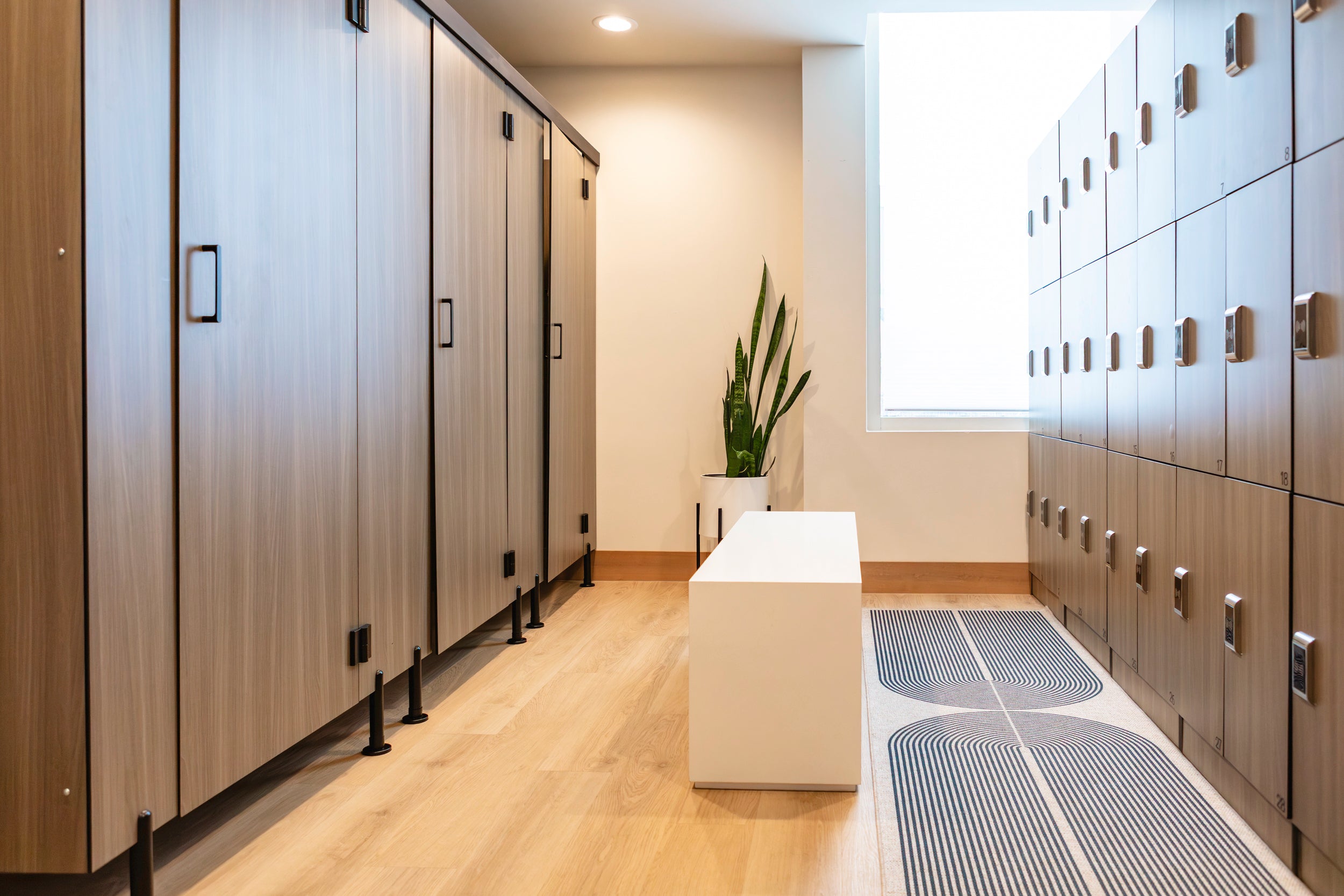 A serene, clean, brightly lit locker room in a luxury spa.