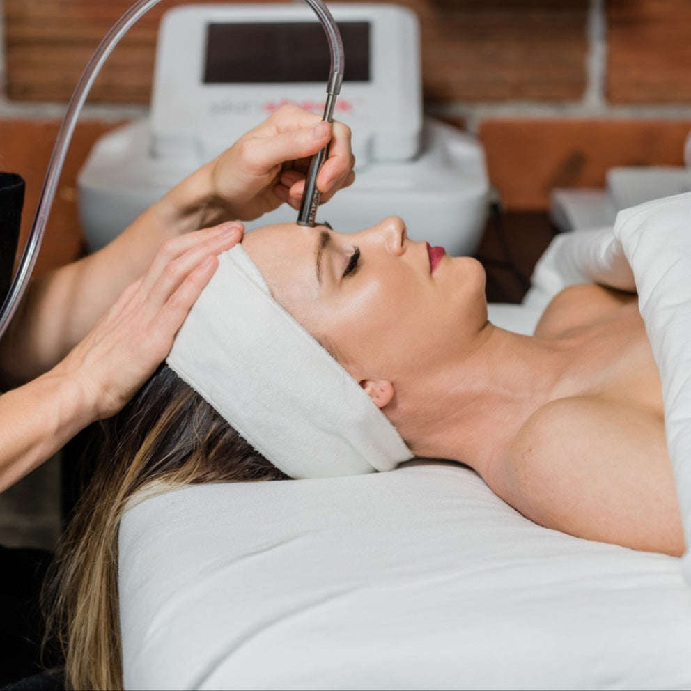 A guest relaxes while receiving a Skin Sheek treatment to remove minor skin irregularities at Pure Skin Wellness Spa